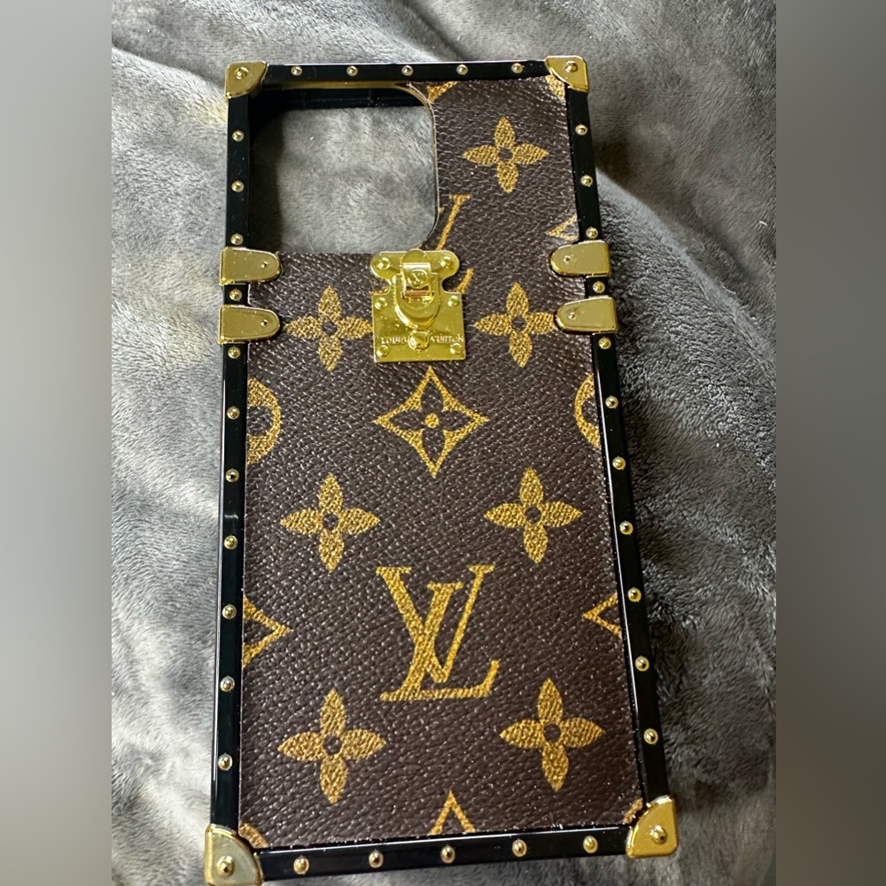 Phone case for iPhone 14 Pro Max. Louis Vuitton trunk replica.
